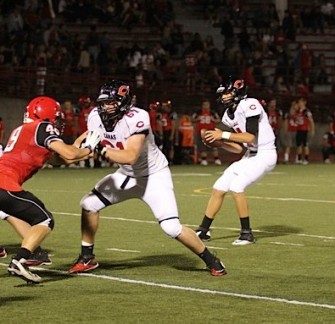 Drew Clarkson, 61, blocking for Eastern Washington Commit Reilly Hennessey.