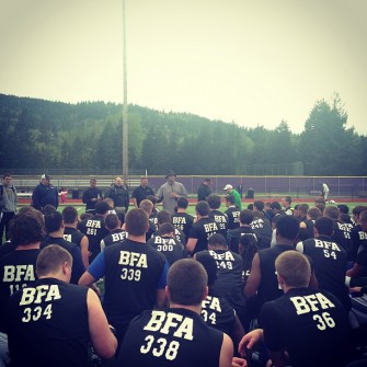 Coach Taylor Barton with members of the media at the Issaquah Combine