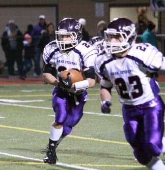 Austin Otis running behind the block of Tanner Krenz