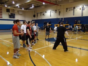 (Coach Taylor Barton working with the QBs)