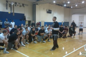 (Coach Taylor Barton speaking to the elite athletes before the session)