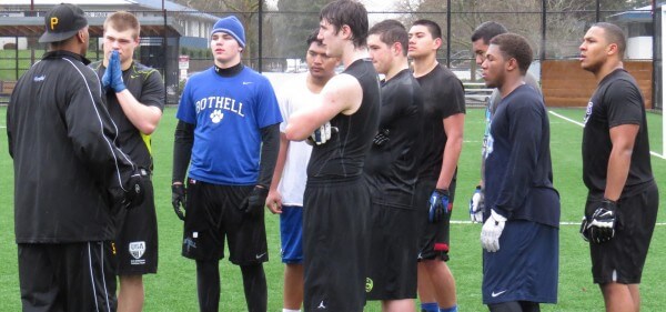 Barton coach Dion Alexander talking to the LB's before the one-on-one session.