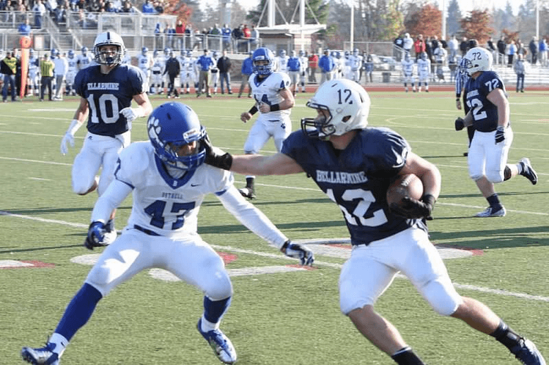 (Millie with a stiff arm in a first round playoff game against Bothell)