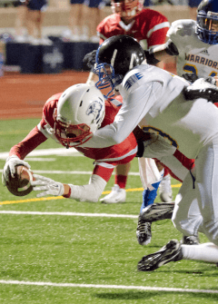 Reid Roelofs diving for a TD.