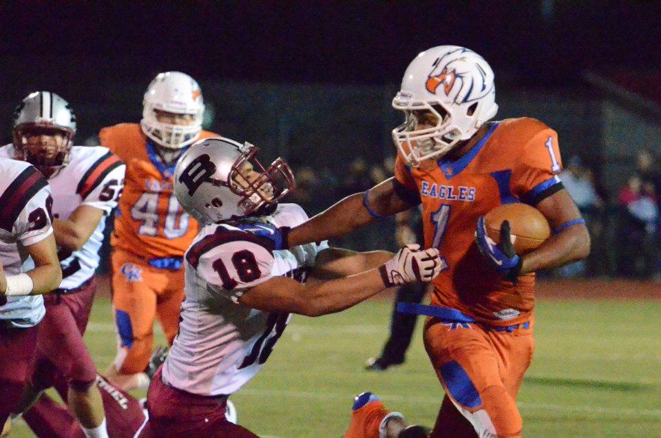 Teague James with a stiff arm. (Photo: LouAnn Crook, gksports.smugmug.com)