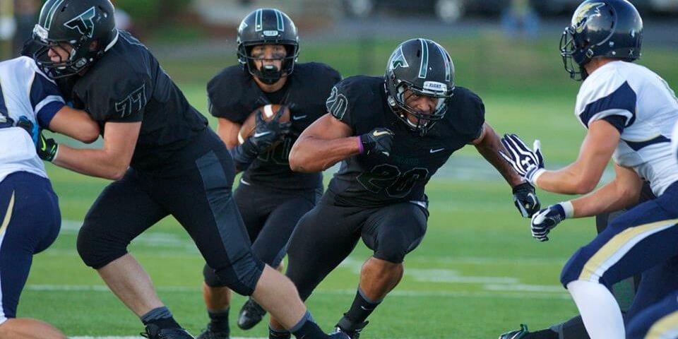 Manu Rasmussen running behind AJ Hotchkins (Photo: Ralph Greene Sr.)